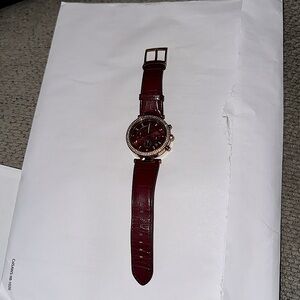 Mk gold maroon watch